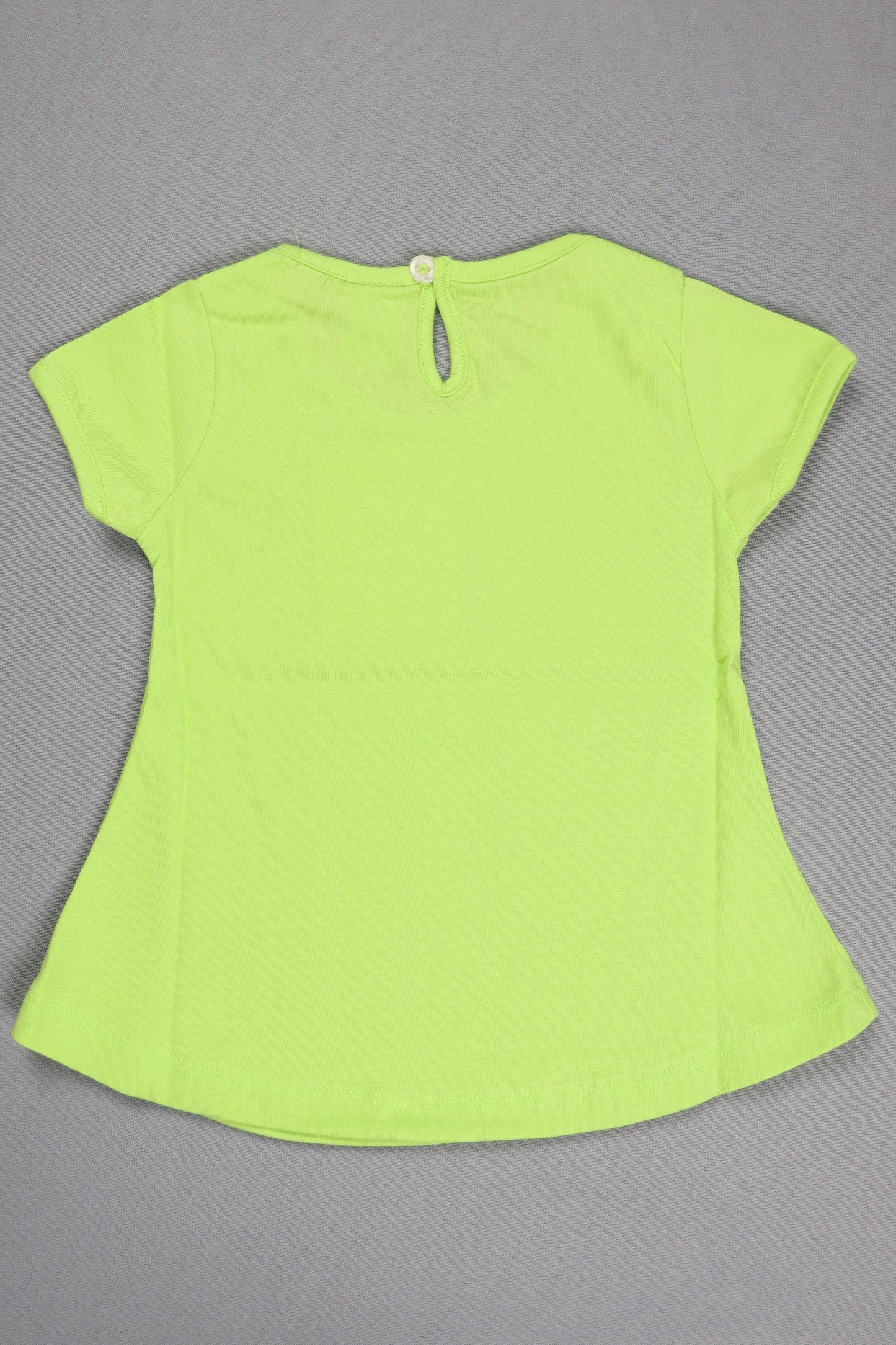 Back view of a bright yellow-green short sleeve cotton kids top with button closure