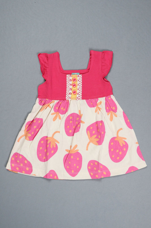 Children's dress with strawberry pattern on a gray background