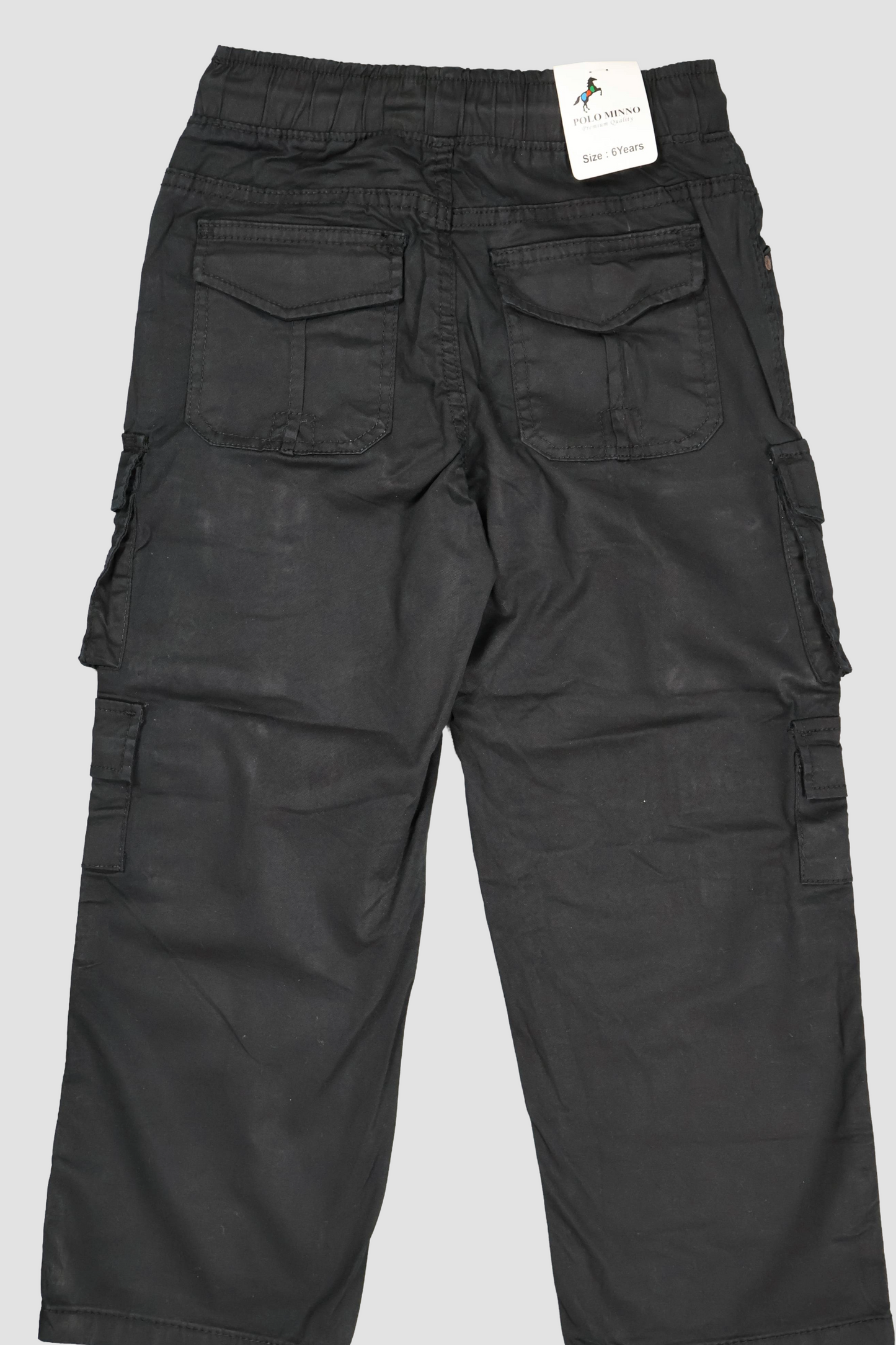 Black cargo pants with a tag on a light gray background