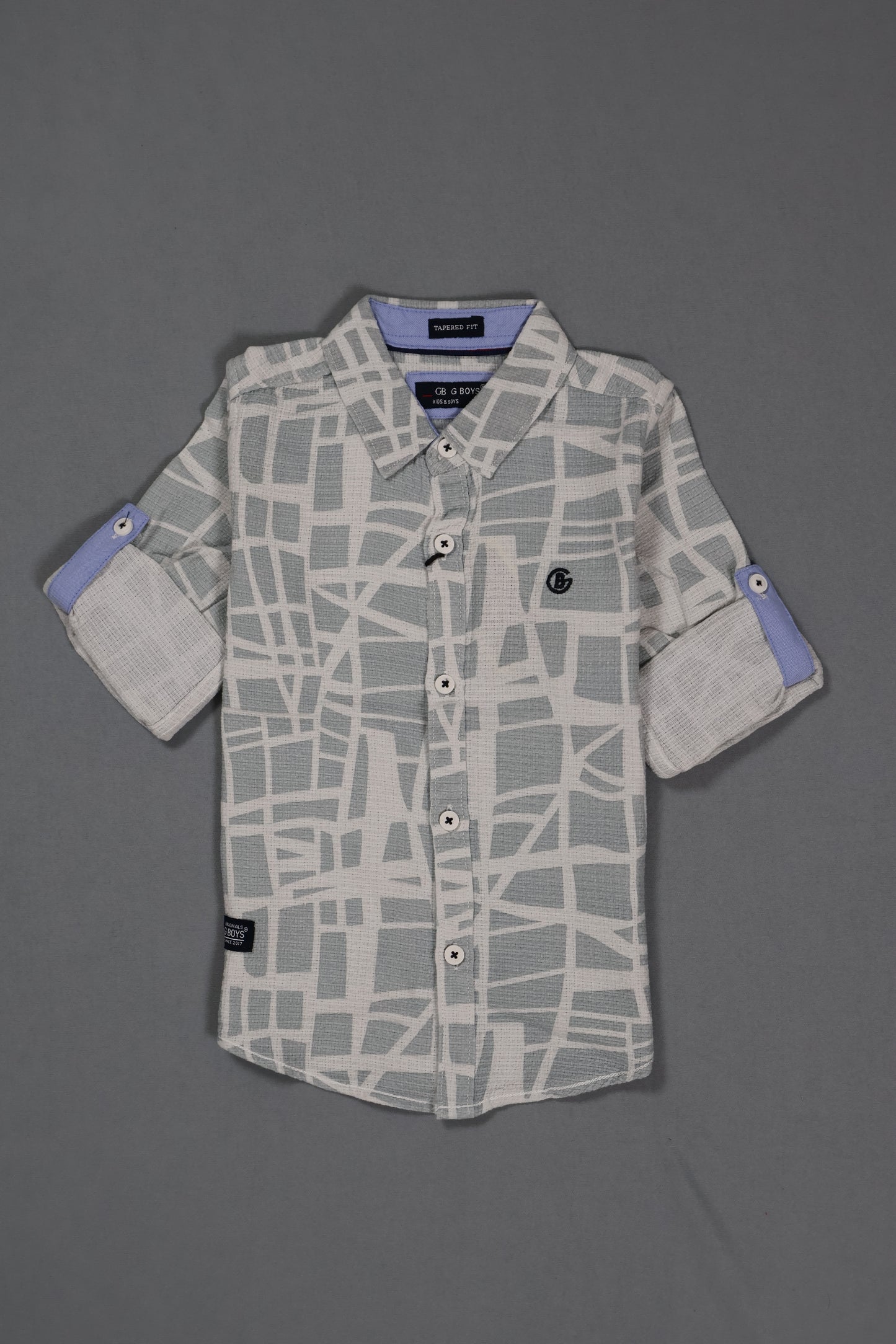 Gray patterned shirt on a gray background
