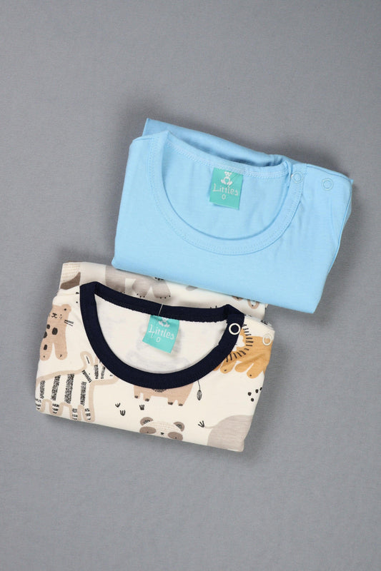 Two folded shirts, one light blue and one with a pattern, on a gray background