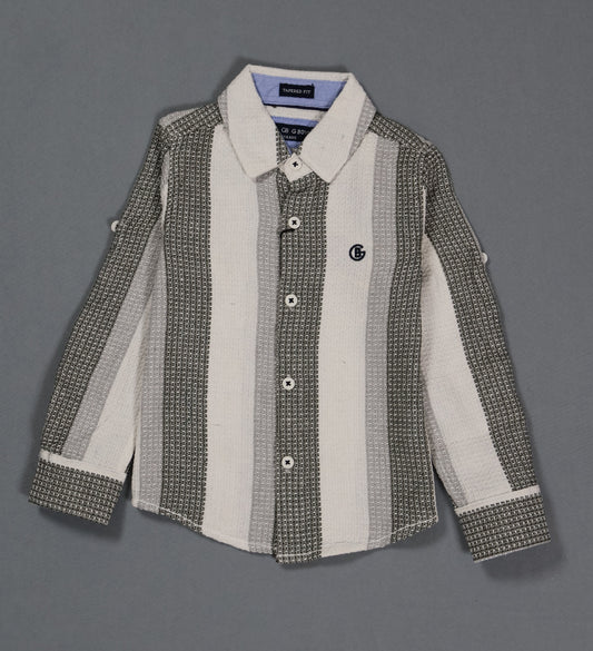 Children's shirt with a patterned design on a gray background
