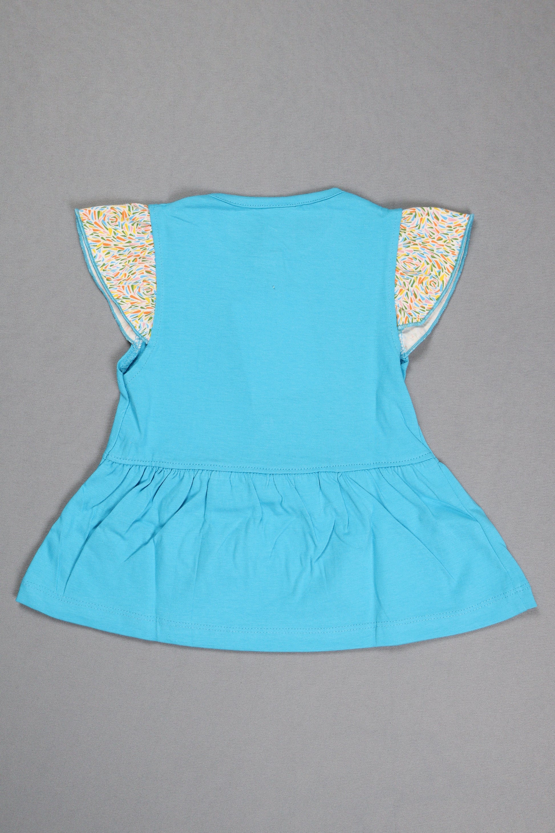 Blue dress with floral sleeves on a gray background