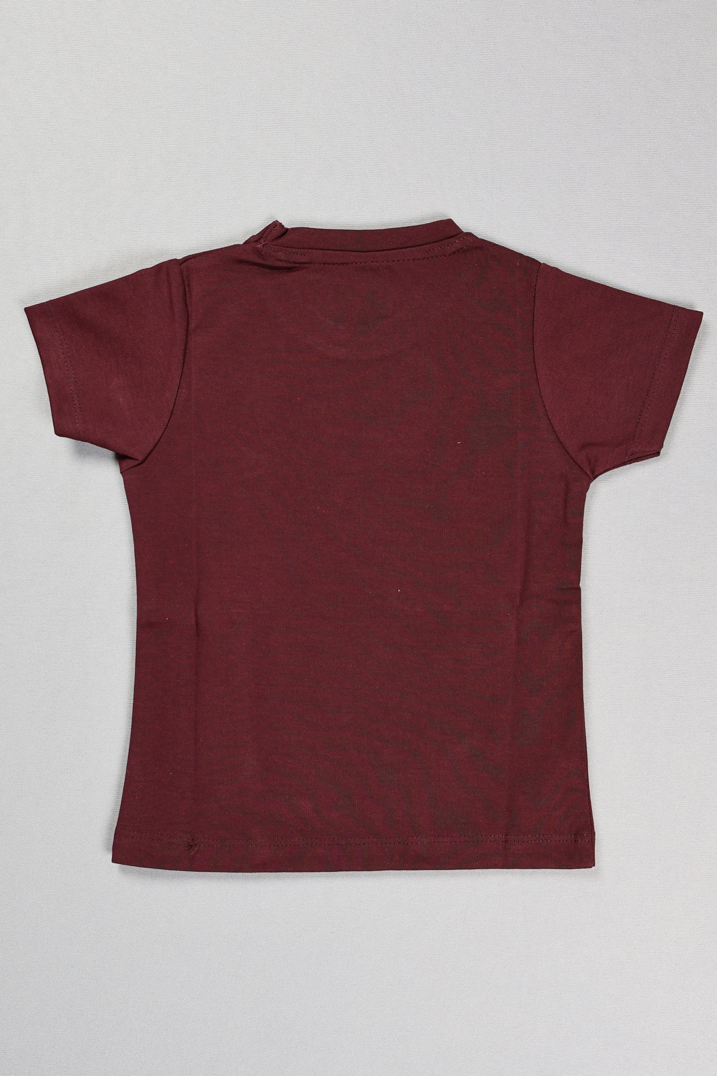 Maroon t-shirt on a light gray background
