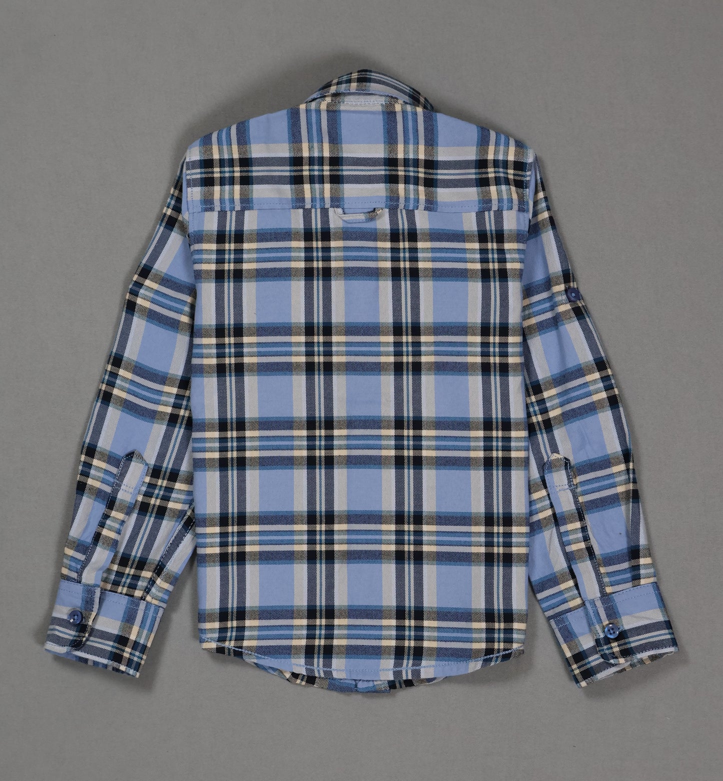 Back view of kids blue plaid cotton shirt with long sleeves on gray background