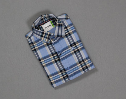 Folded blue and white checkered cotton kids shirt on gray background