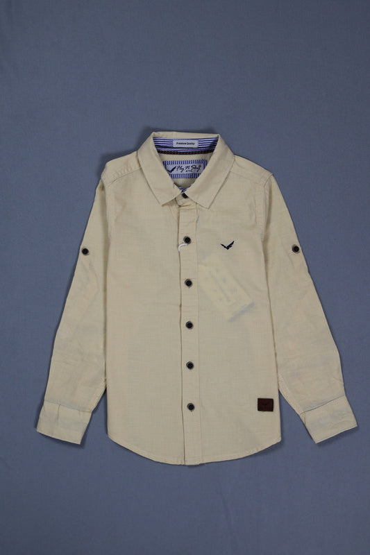 Beige jacket with a label on a blue background