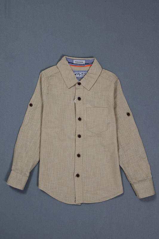 Fyst Boys' Beige Textured Long-Sleeve Button-Down Shirt with Single Chest Pocket and Roll-Up Sleeve Tabs, flat lay view on grey background.