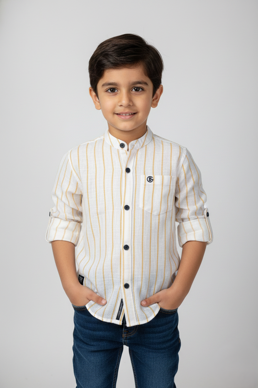 A young boy wearing a bright yellow and white vertical striped full-sleeve shirt. The shirt features a modern mandarin collar, a front chest pocket with a small brand tag, and dark contrast buttons. The sleeves are rolled up and secured with tabs. The image shows a front view of the child against a neutral background.