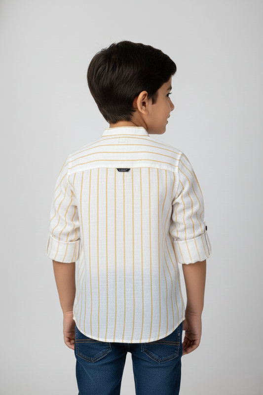 Child wearing a white shirt with yellow stripes on a plain background