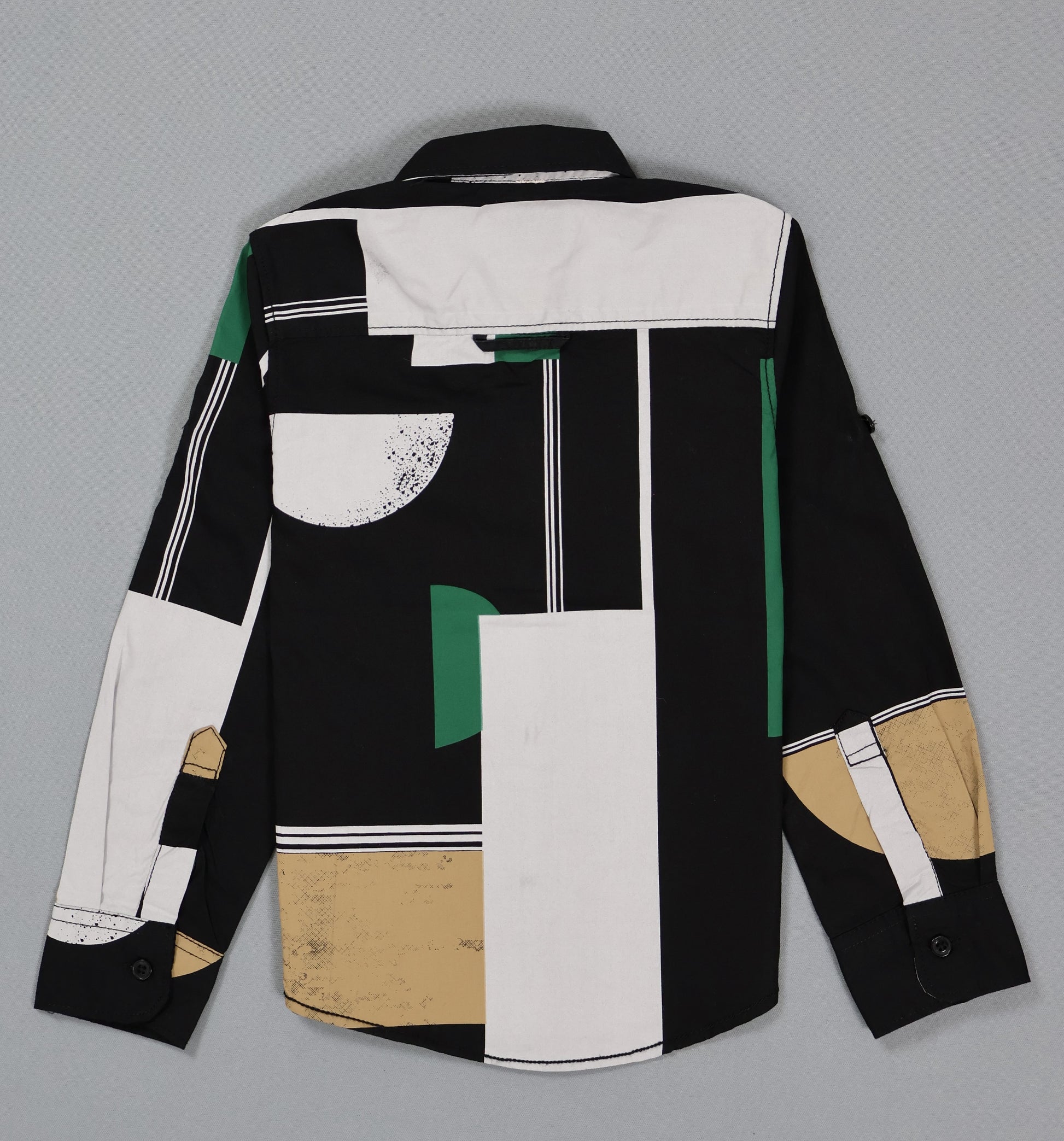 Kids cotton shirt with abstract geometric black, white, green, and beige pattern, back view