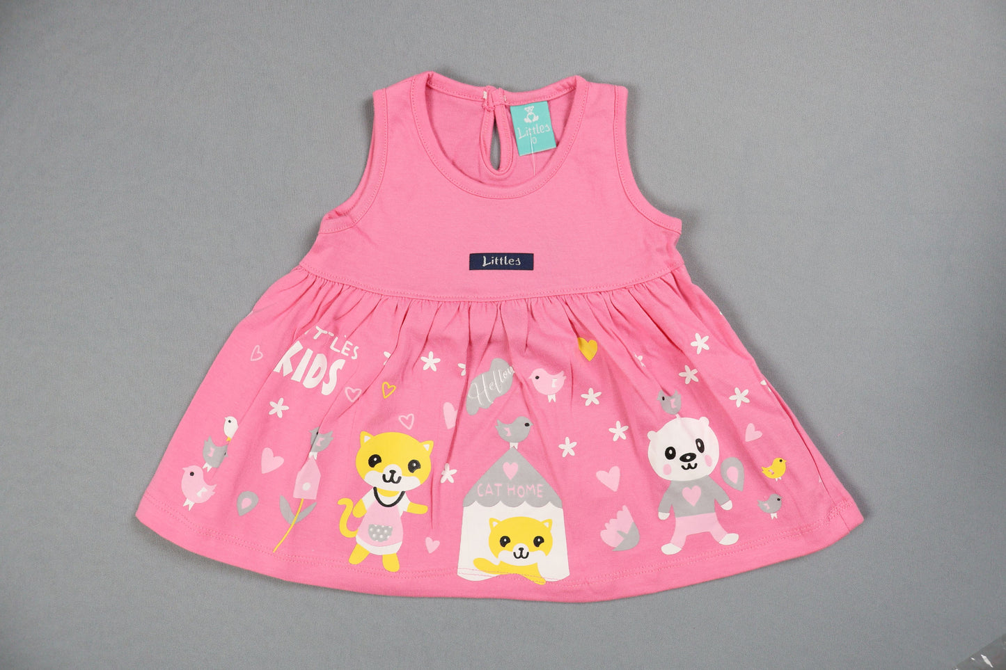 Pink baby romper with cartoon designs on a gray background