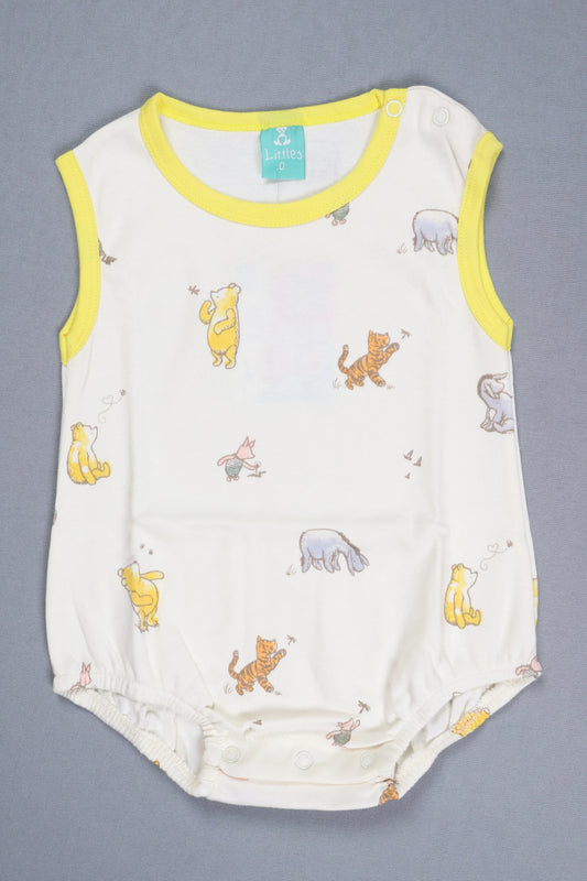 Baby romper with animal prints on a gray background