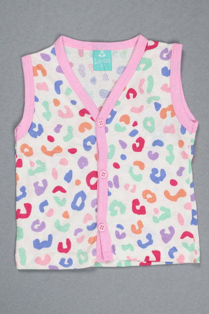 Baby romper with colorful leopard print and pink trim on a gray background