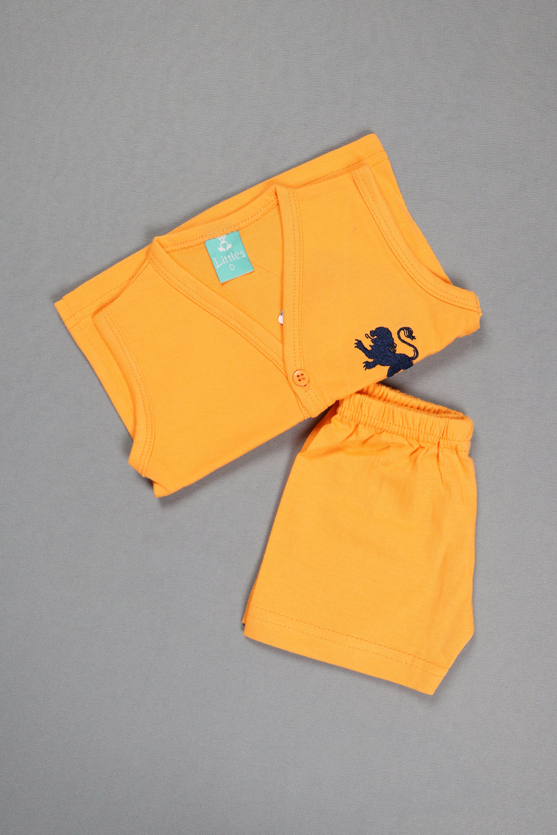 Orange shorts with a black design on a gray background