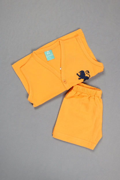 Orange shorts with a black design on a gray background
