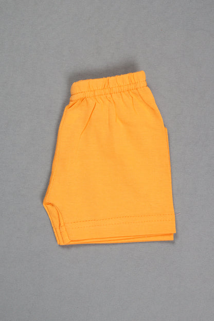Folded orange fabric on a gray background