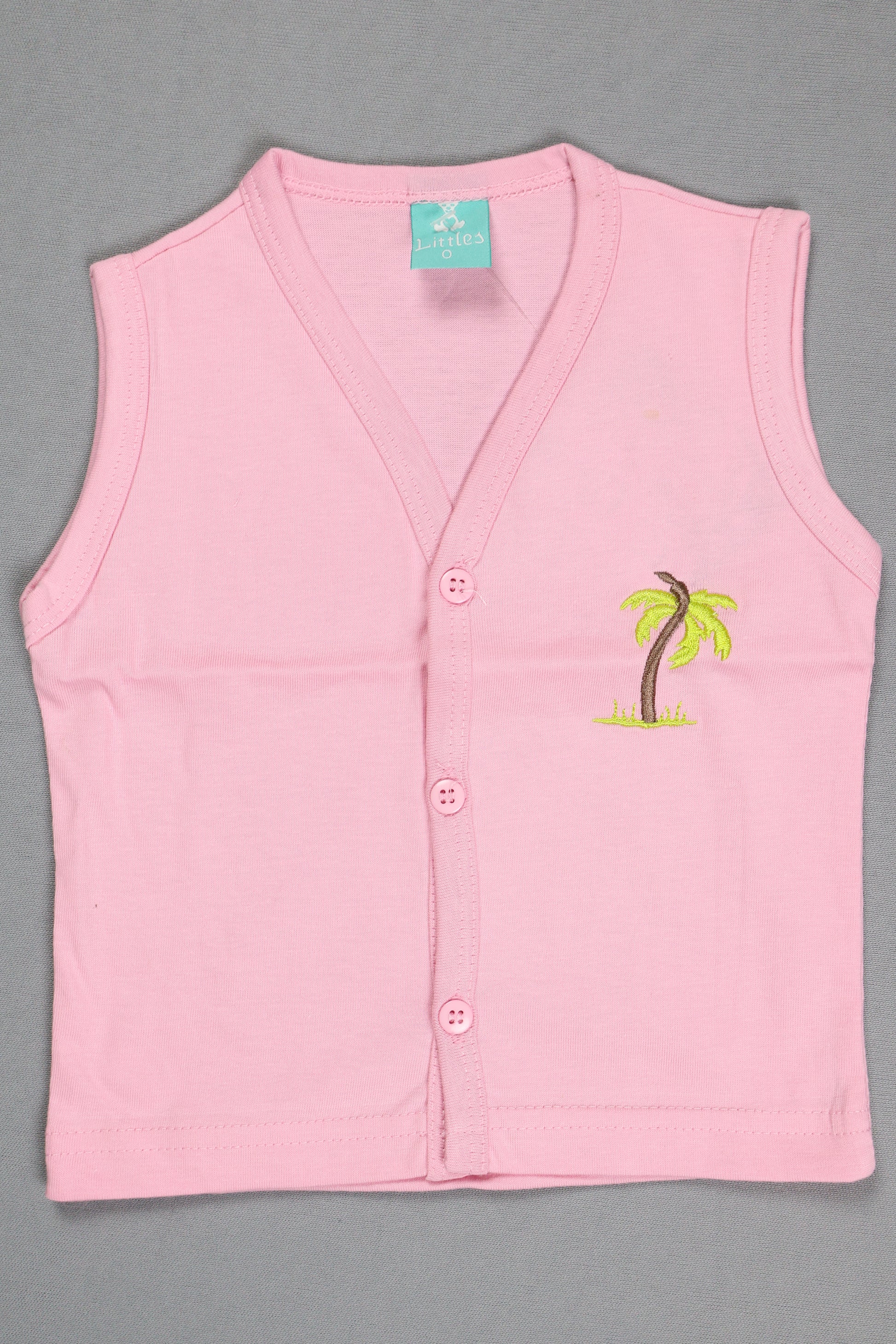 Pink sleeveless top with a small design on a gray background