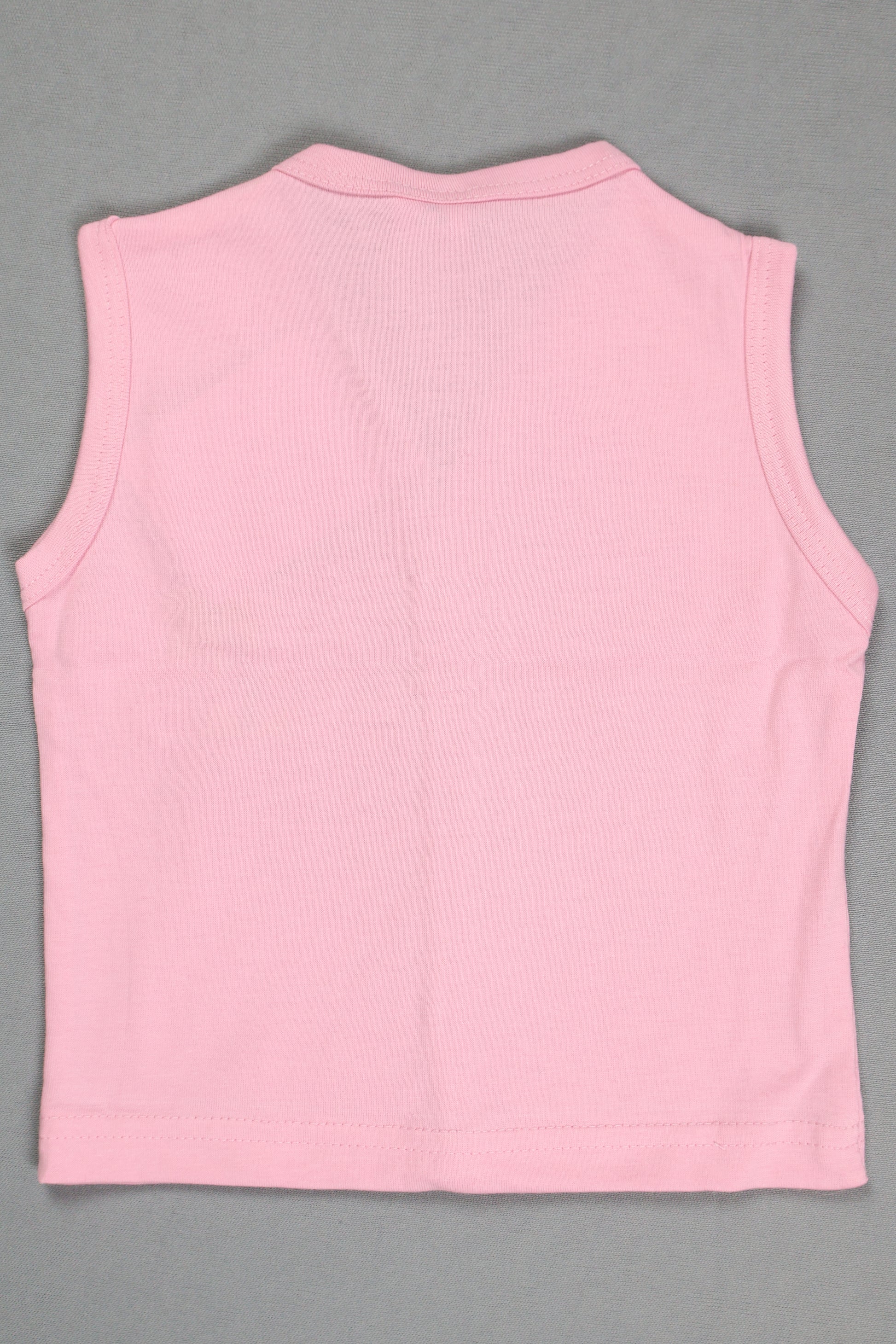 Pink sleeveless top on a gray background
