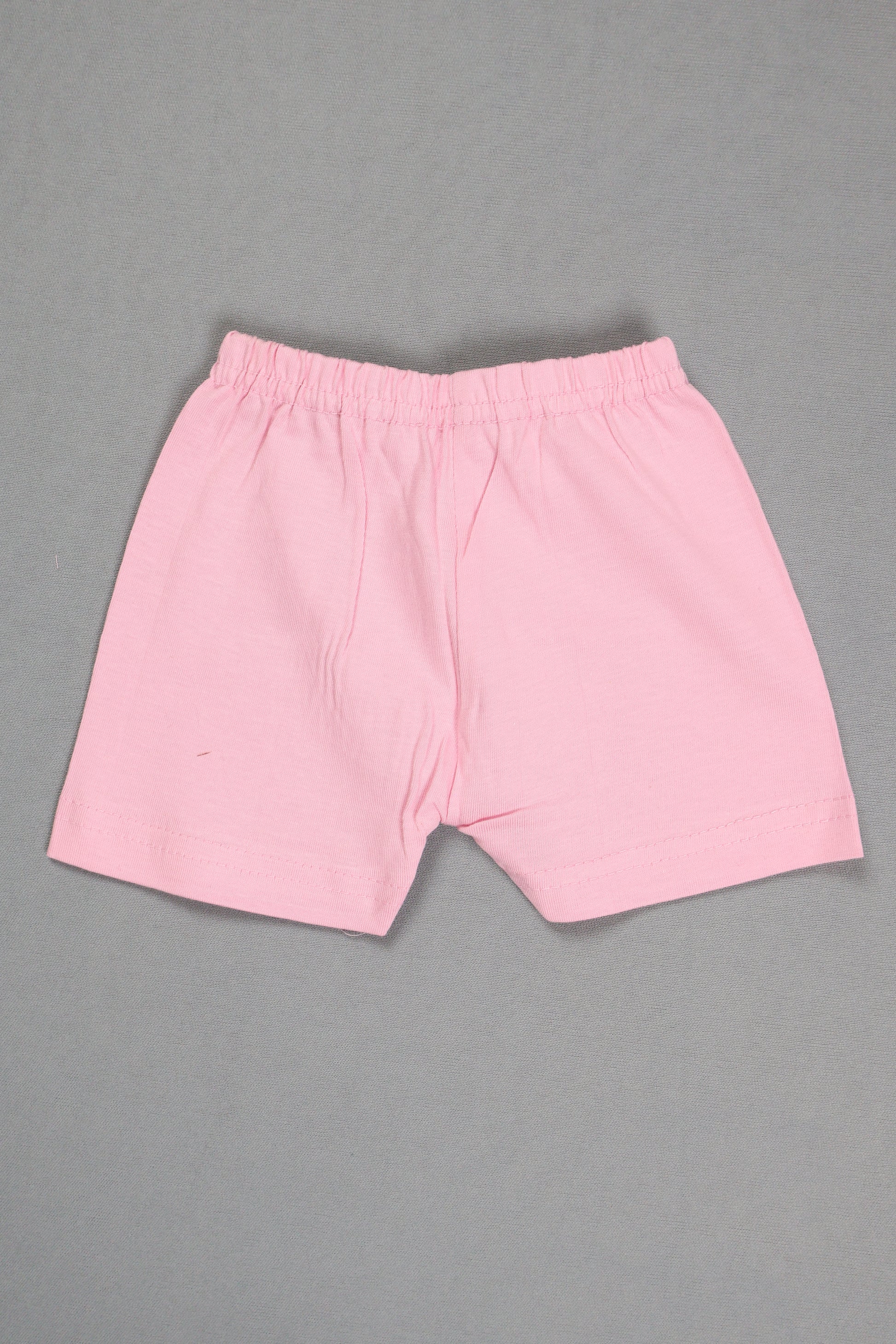 Pink fabric piece on a gray background