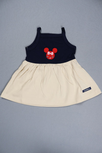 Children's dress with a red bow design on a gray background