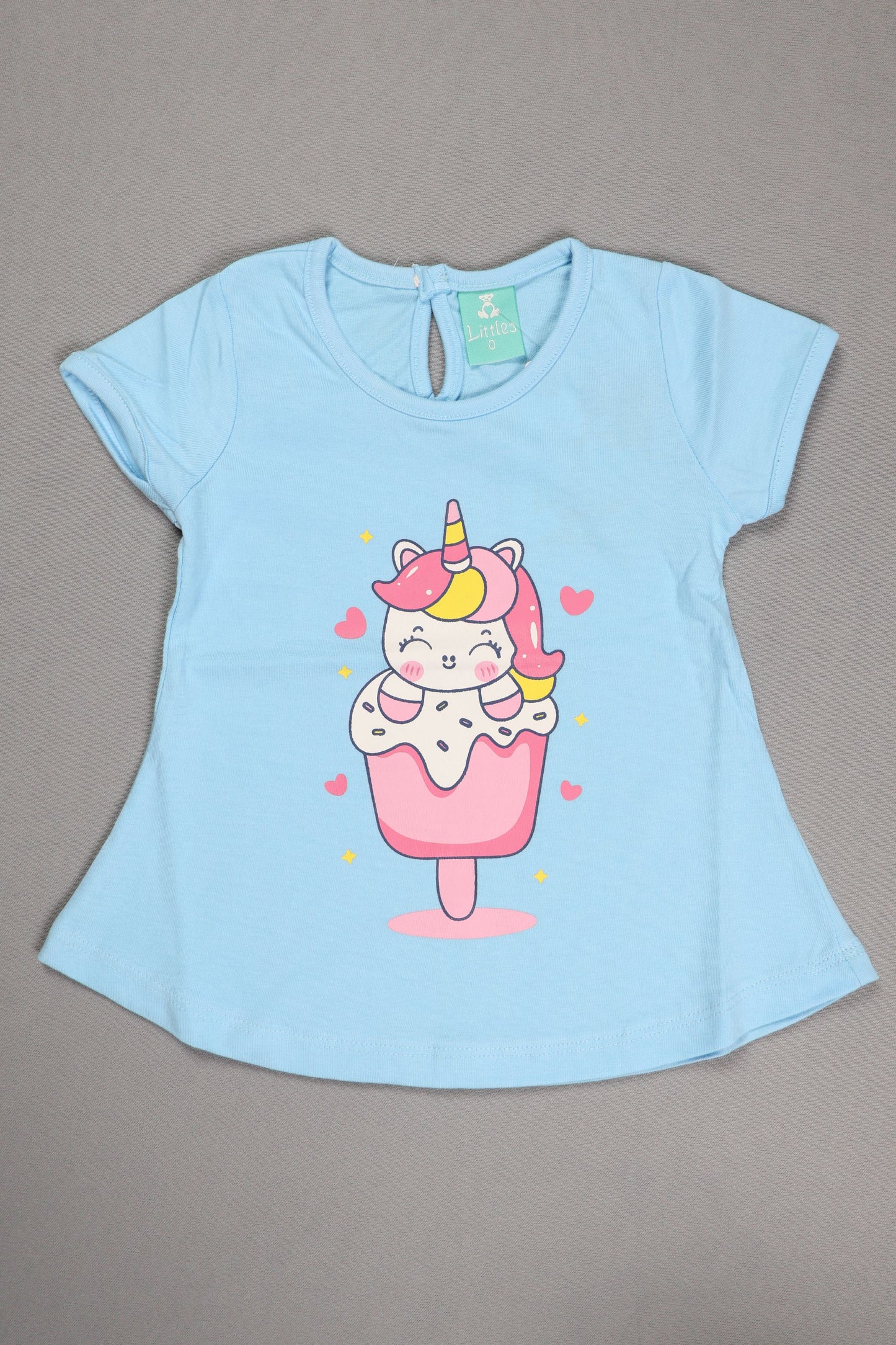 Light blue pet shirt with a unicorn ice cream design on a gray background