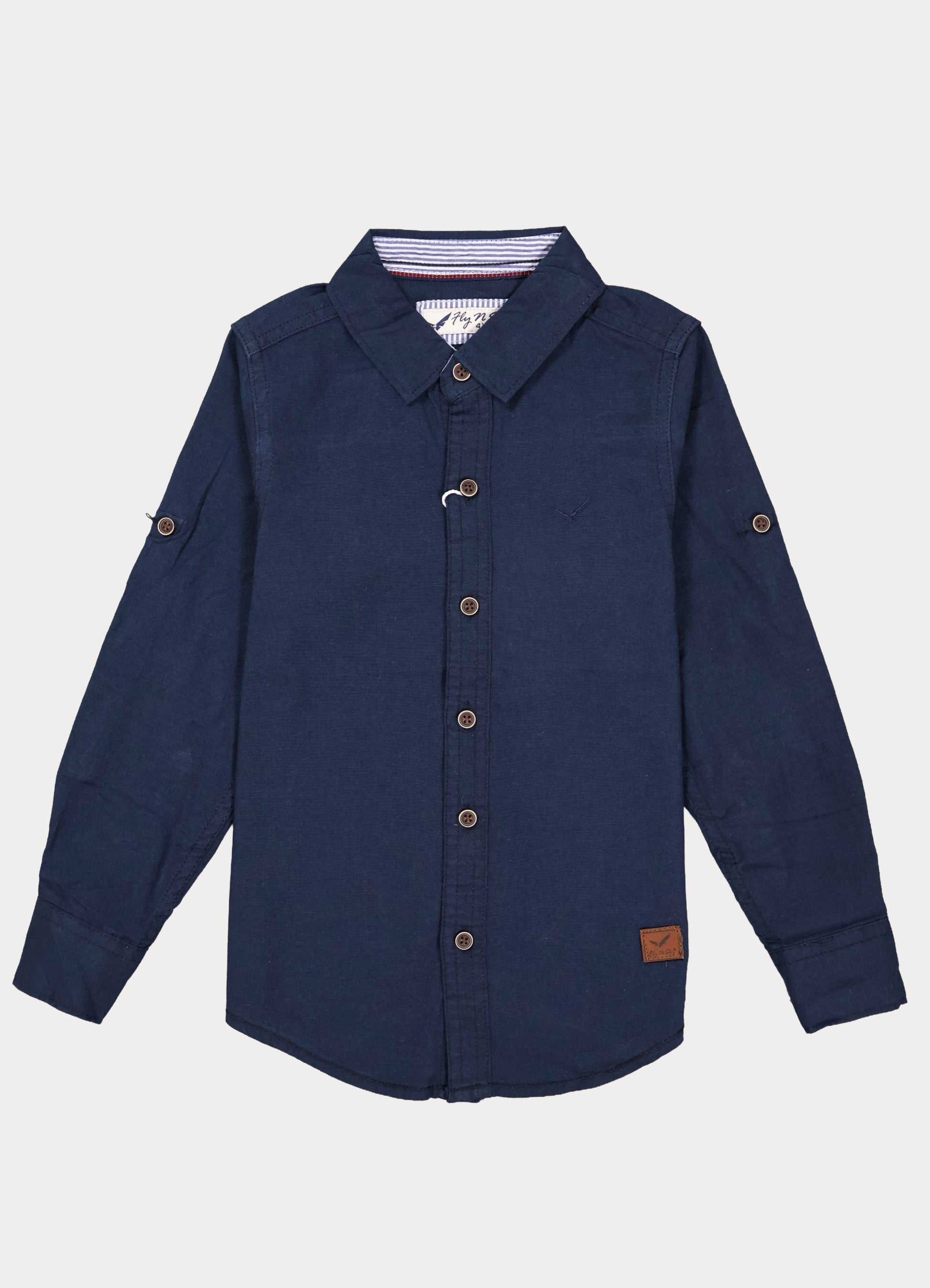 "A high-resolution product showcase of the Fyst boys' navy blue casual shirt. The primary image displays a crisp, long-sleeved button-down made from textured premium cotton, featuring contrasting wood-toned brown buttons and a classic spread collar. Accompanying thumbnails highlight the functional roll-up sleeve tabs secured with buttons at the mid-arm and the curved hemline designed for a polished look whether worn tucked or untucked."