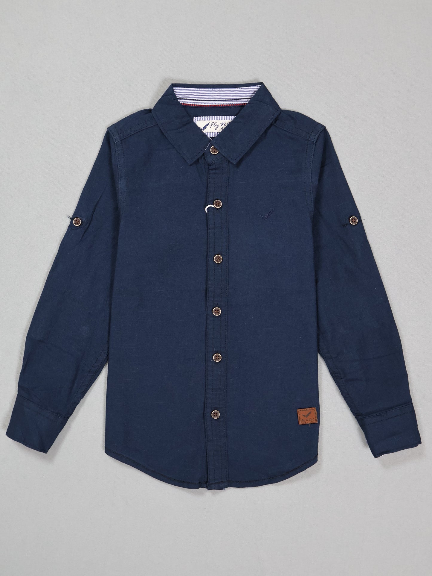 Navy blue button-up shirt on a gray background