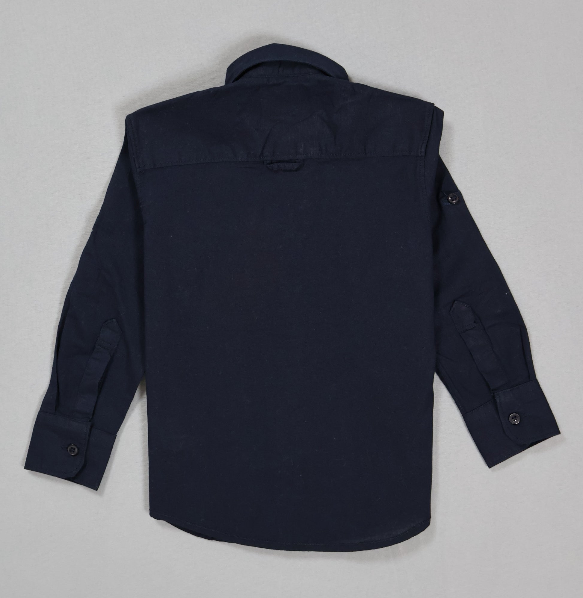 Navy blue shirt on a light gray background