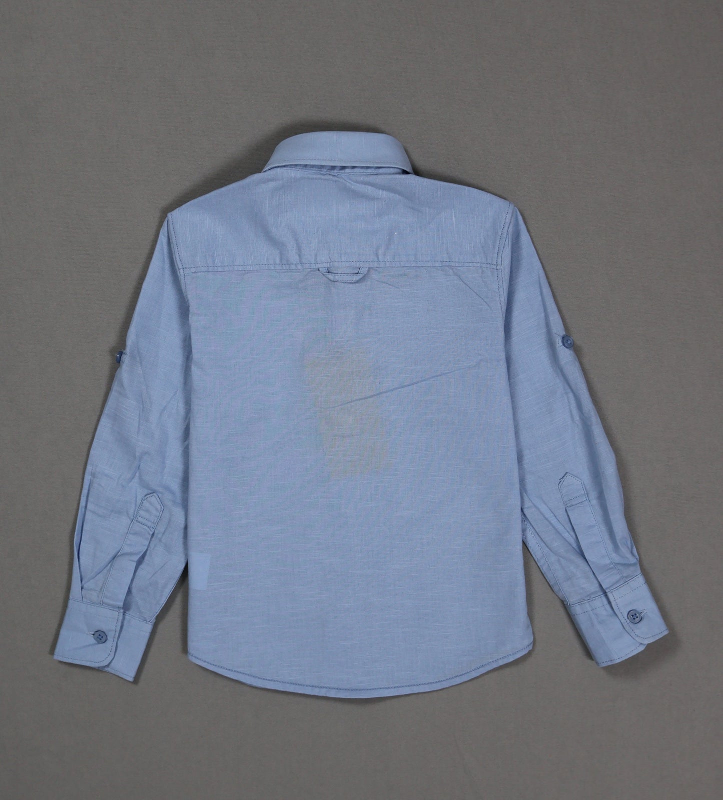 Blue shirt on a gray background