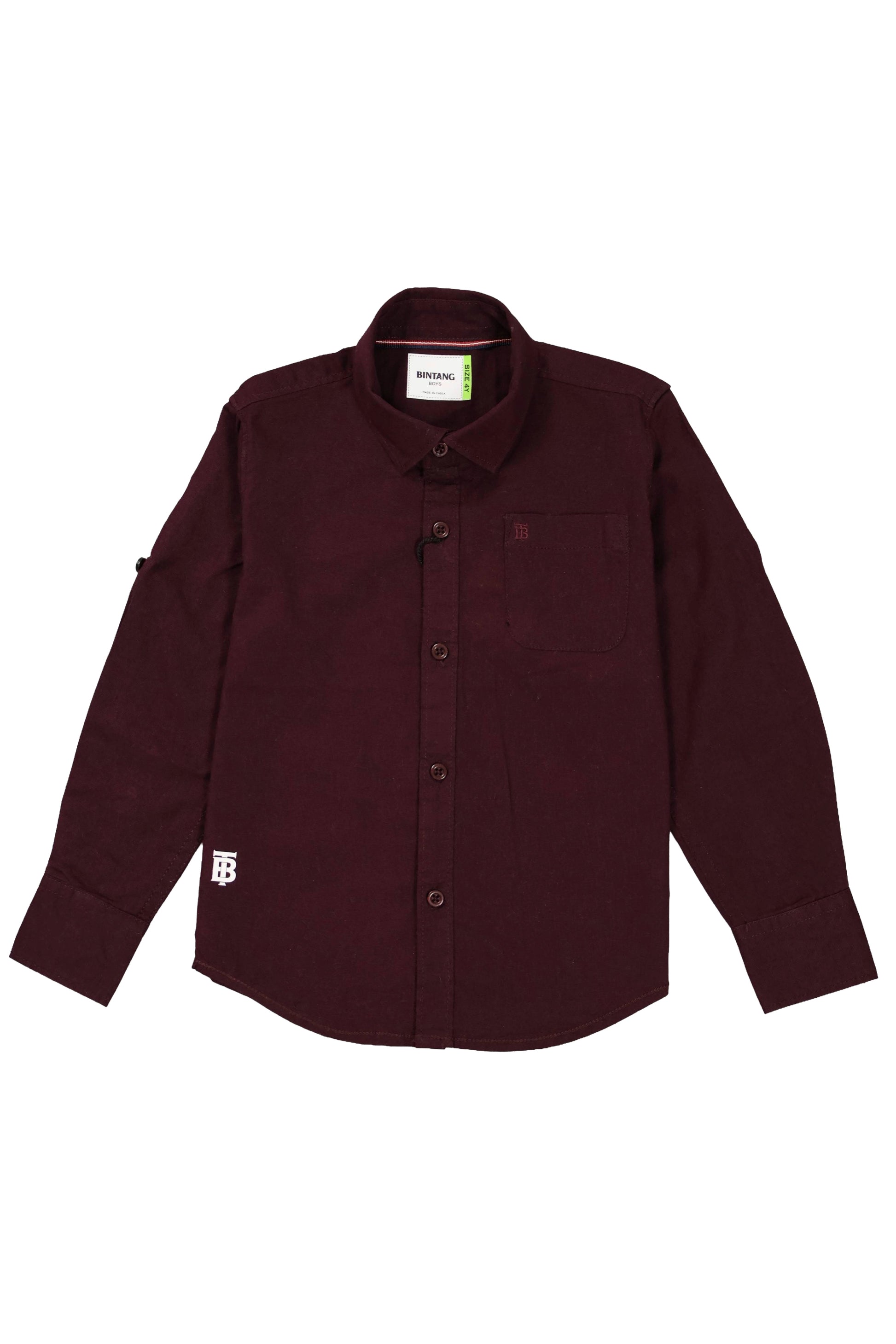 A children's full-sleeve casual shirt in a deep maroon or burgundy color. The shirt features a classic spread collar, a single chest pocket with a small white brand tag at the bottom hem, and matching tonal buttons. The sleeves include roll-up tabs for a customizable look. The garment is shown as a flat lay against a neutral grey background.