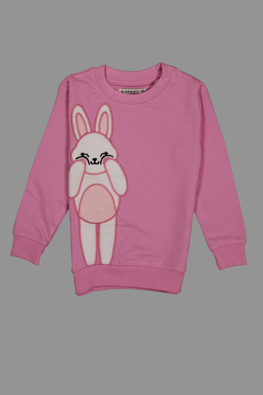 Pink sweatshirt with a cartoon bunny design on a gray background