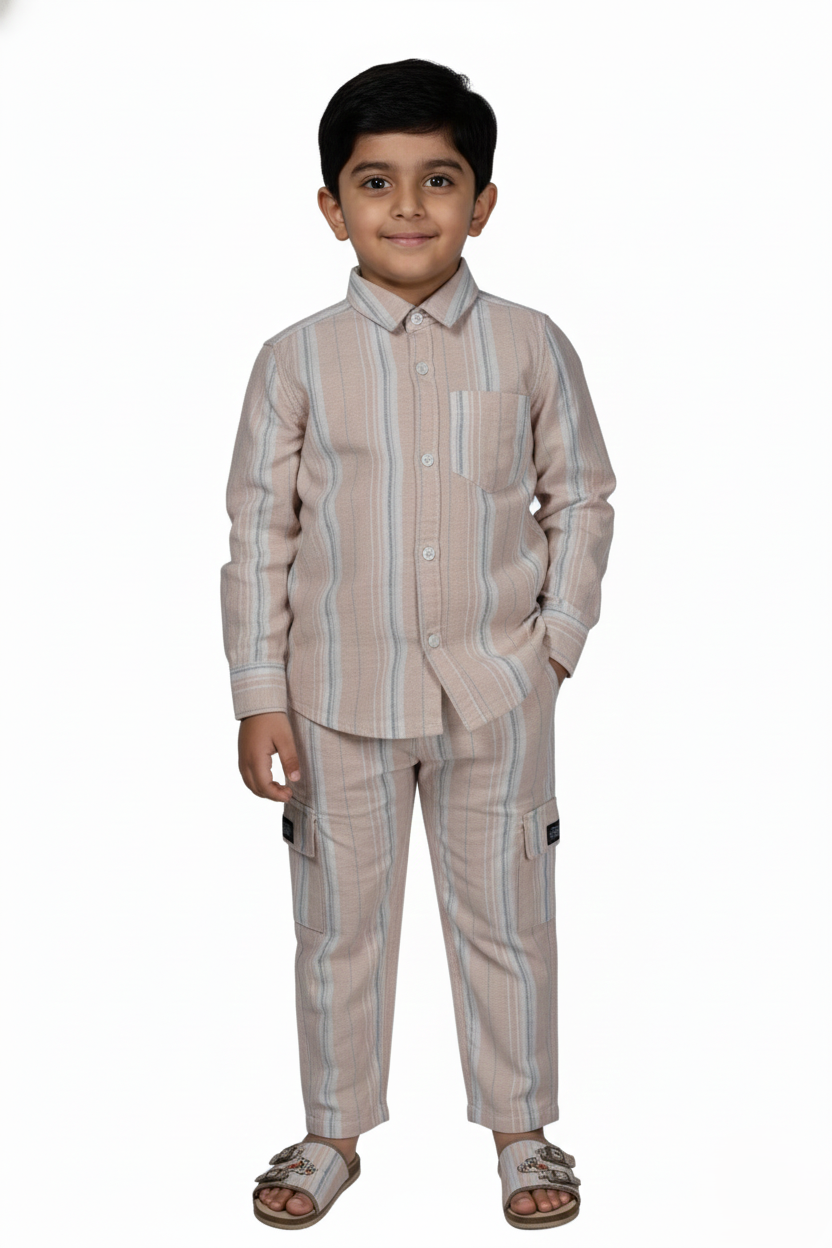 "A comprehensive product gallery featuring the Fyst boys' striped co-ord set. The primary image shows a young boy modeling the complete outfit, which consists of a beige long-sleeved shirt with vertical blue and white stripes paired with matching straight-cut trousers. Supplementary images provide a detailed look at the individual pieces: a button-down shirt with a classic collar and chest pocket, and matching trousers featuring a comfortable elasticated waistband and black drawstring. The high-quality cott