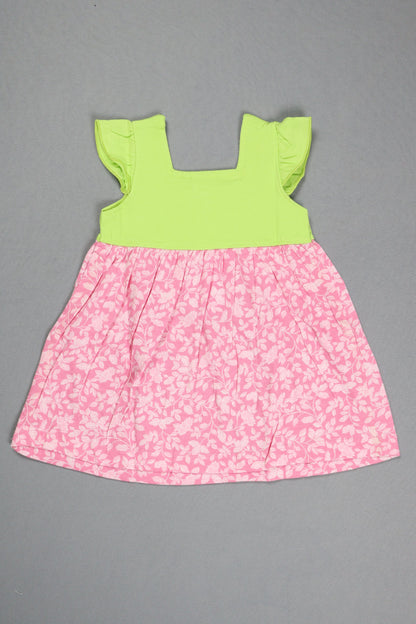 Pink floral fabric and green fabric on a gray background