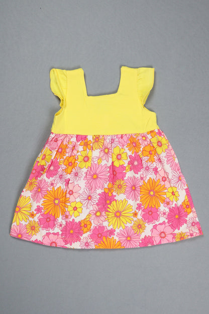 Floral fabric piece with pink and yellow flowers on a gray background