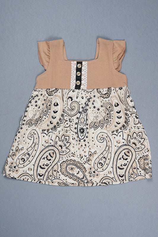 Fabric with paisley pattern and beige top on a gray background