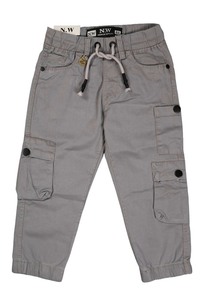 A pair of children's utility cargo pants in a light grey color. The pants feature a comfortable elastic waistband with a matching light grey drawstring, standard side pockets, and several cargo pockets on the legs with secure black button closures. They are shown as a flat lay against a neutral background.